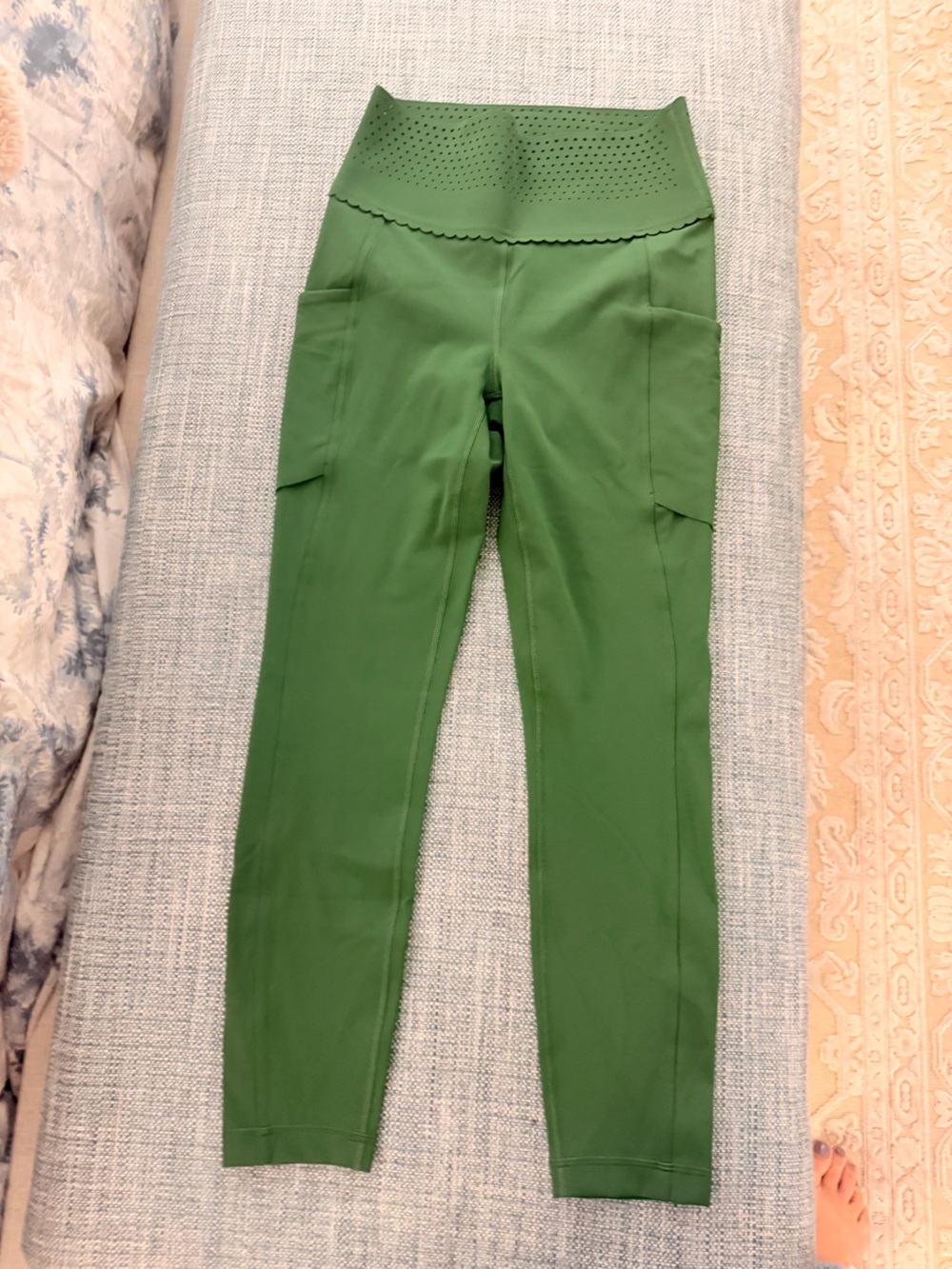 NWOT ululemon leggings with laser cut and scalloped waist detail. Never worn.